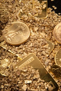 large samples of pure gold in various forms including coins, ingots, bars, dust and nuggets
